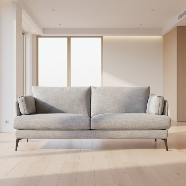 Light grey fabric sofa with split back cushions and square arm pads