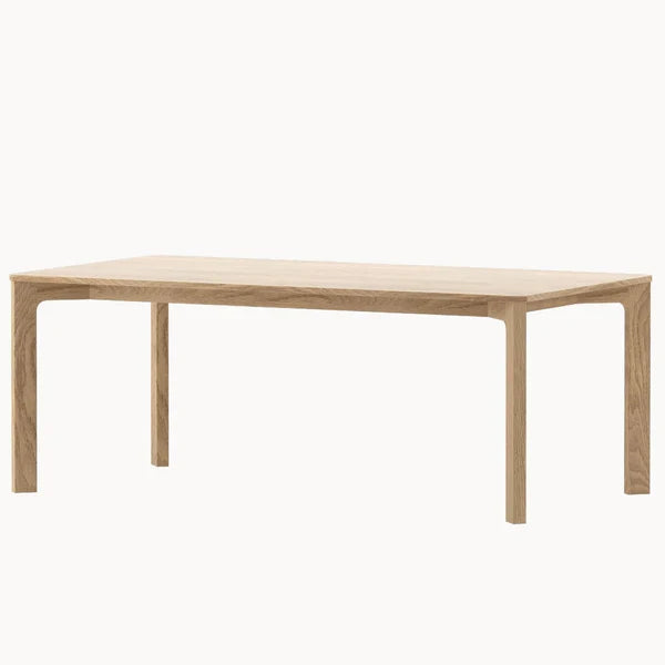 Rectangular light wood dining table with four straight legs