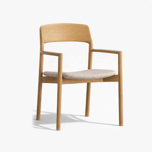 Light wood armchair with upholstered seat and arms, curved back.