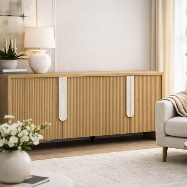 Modern living room with wooden sideboard, lamp, and sofa.