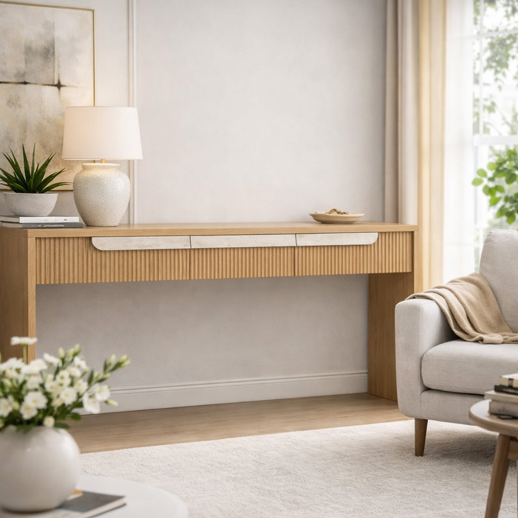 Modern living room with a wooden console table, lamp, and decor items.