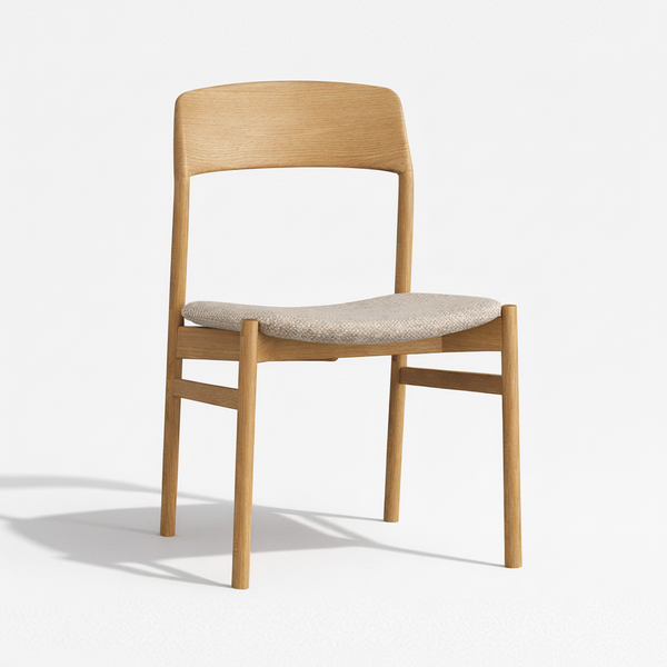 Light wood dining chair with upholstered gray fabric seat and curved backrest
