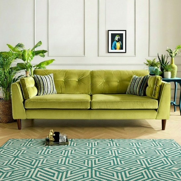 Apple green velvet sofa with two seat sections and button-tufted back