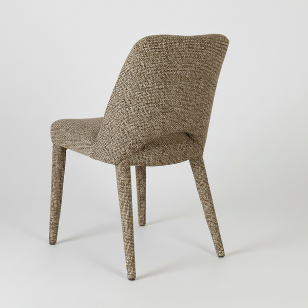A modern dining chair upholstered in a textured, woven taupe-brown fabric, shown from a three-quarters angle against a plain white background.