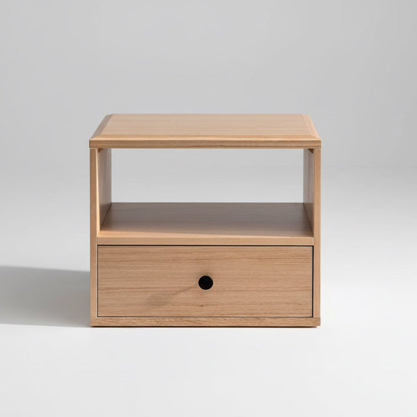 Light wood coffee table with open shelf and one drawer, with a black knob