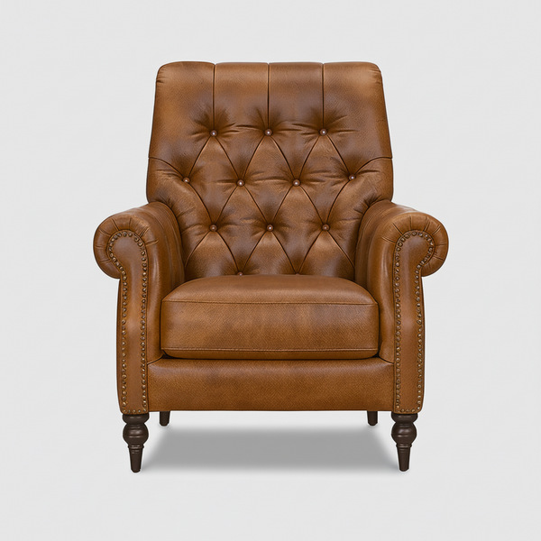 Tan Chesterfield accent chair with button-tufted back, rolled arms, and studded details