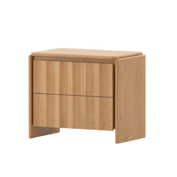 Light wood nightstand with single drawer front and chunky legs.