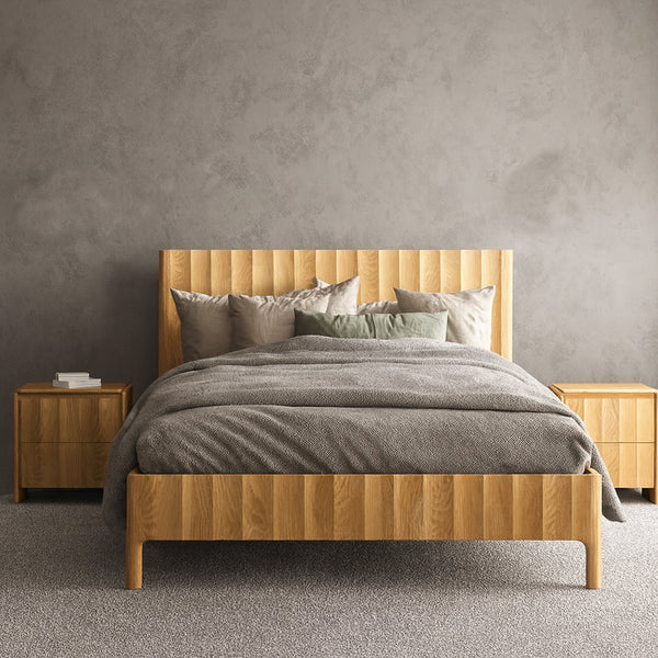 Queen-size wooden bed frame with gray duvet, pillows, and headboard