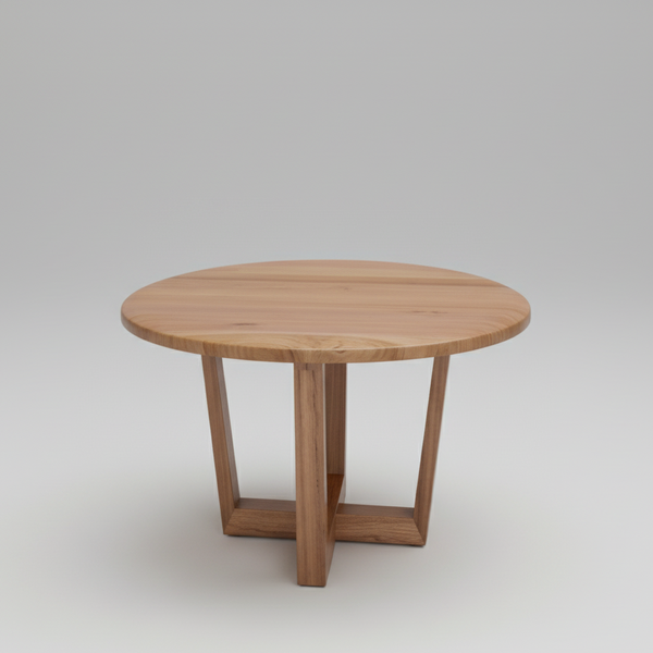 Round light-wood lamp table with four legs and a simple recessed apron
