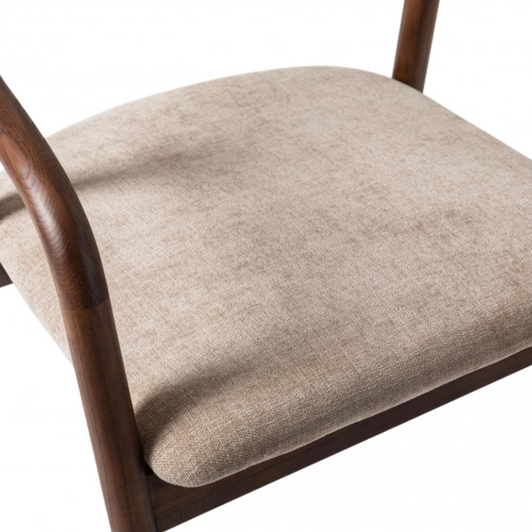 Close-up of a chair seat cushion upholstered in a textured beige fabric, set against a dark brown wooden frame on a white background.