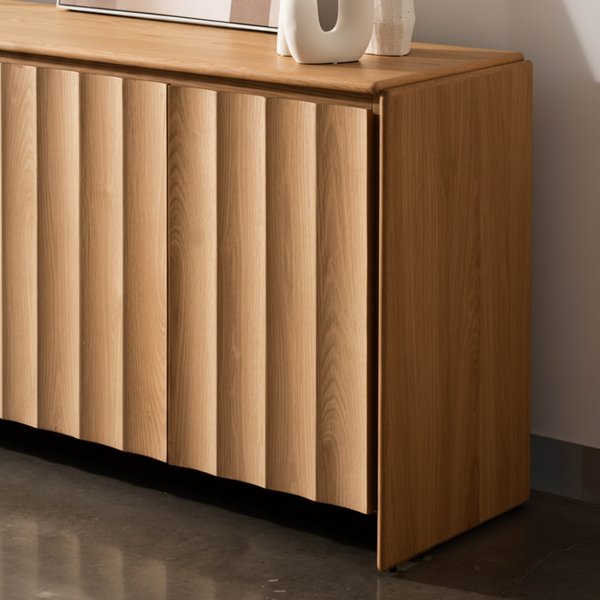 Light wood buffet cabinet with vertical panel doors and flat top