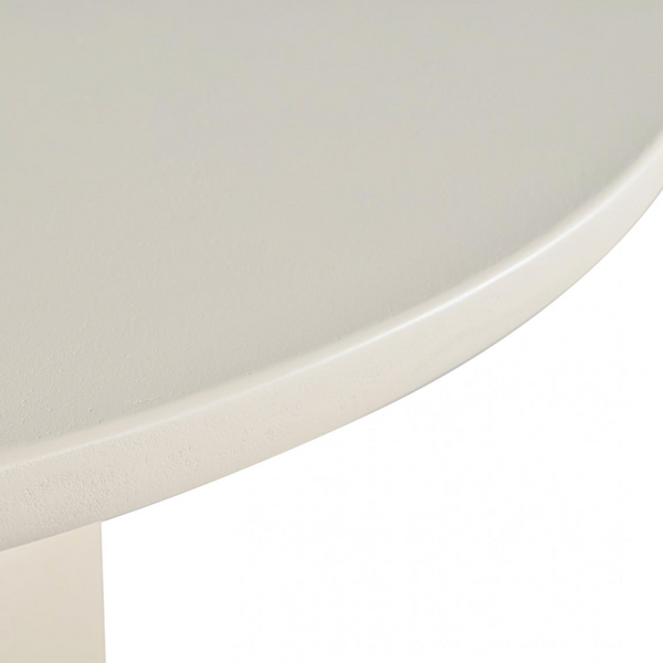 Close-up of a white oval tabletop showing the smooth curved edge and part of the matching white pedestal base against a white background.