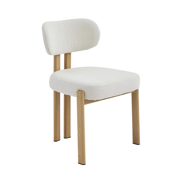 Beige fabric dining chair with rounded back, padded seat, and light wood legs