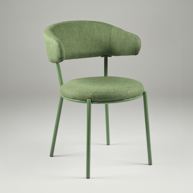 An upholstered dining chair with a curved backrest and a round seat cushion in a textured sage green fabric, supported by a matching sage green metal frame with four legs, shown against a plain white background.