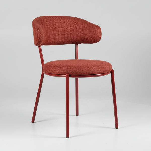 A modern dining chair with a curved, cushioned backrest and a round seat, upholstered in a textured rust-red fabric with a matching metal frame, shown against a plain white background.
