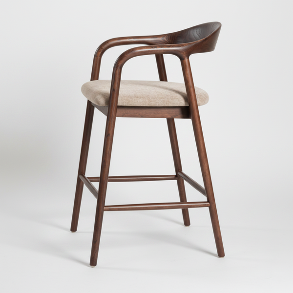 A modern barstool with a curved dark brown wooden frame, a light beige textured fabric seat cushion, and a matching curved wooden backrest, shown against a plain white background.