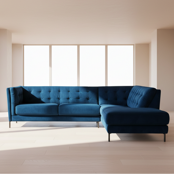 Teal blue velvet corner chaise sofa with tufted back and cushioned chaise armrest