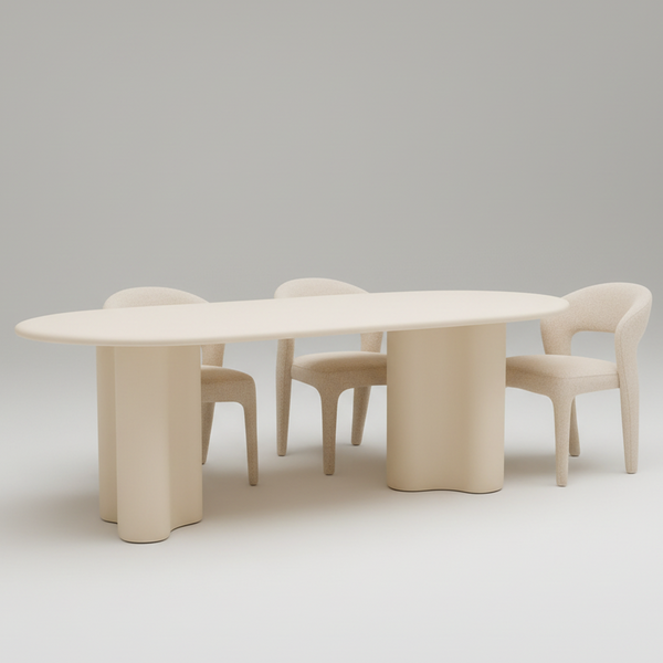 White dining table with beige upholstered chairs and rounded pedestal base