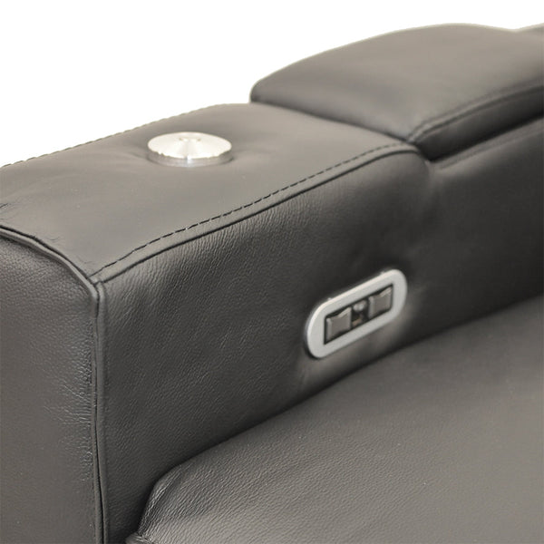Black leather recliner chair arm control buttons and padded headrest detail.
