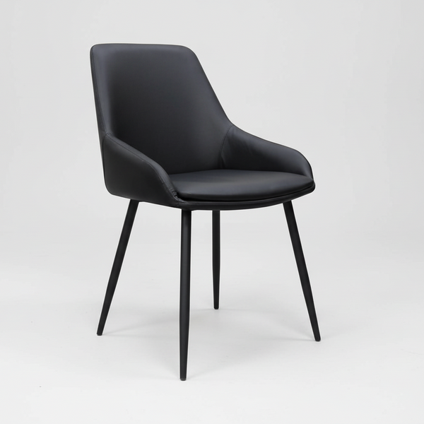 Black dining chair featuring upholstered seat, curved back, and four tapered legs