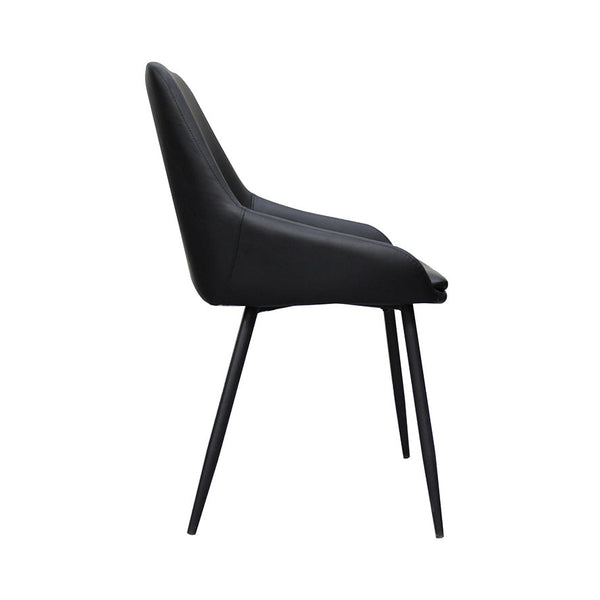 Side view of black upholstered dining chair with curved back and tapered legs