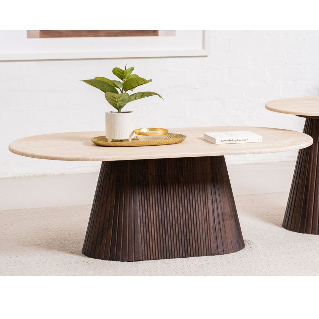 Round accent table with light top and dark fluted pedestal base