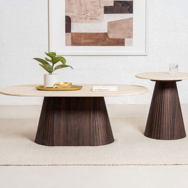 Set of round accent tables with light tops and dark fluted pedestal bases