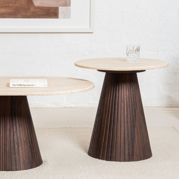 Round accent table with light wood top and dark fluted pedestal base, side view