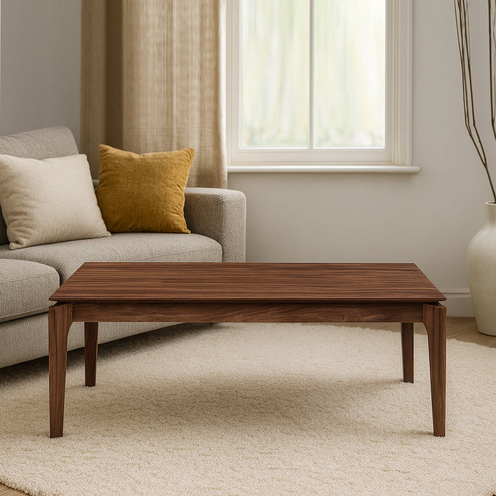 Wooden coffee table with dark brown top and four tapered legs