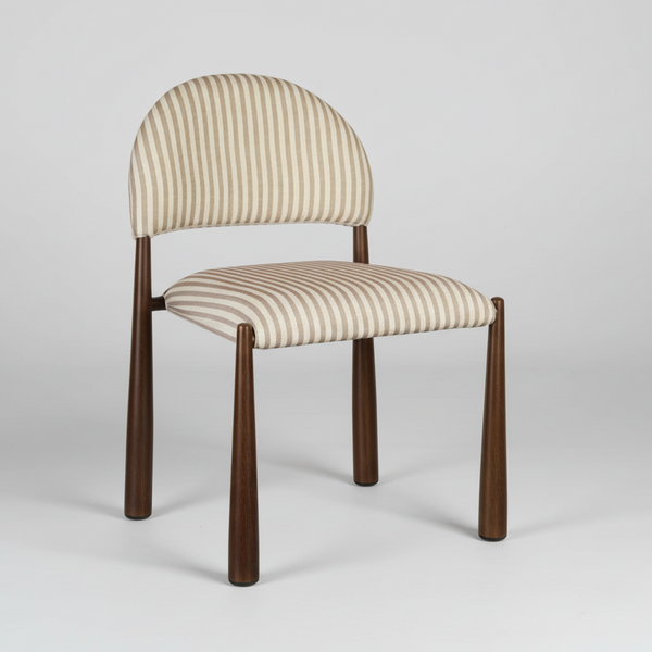 Striped chair with wooden legs on a light gray background