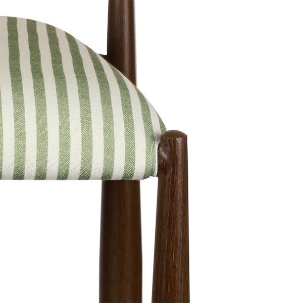 Walnut chair side panel with moss green striped upholstery and wooden arm