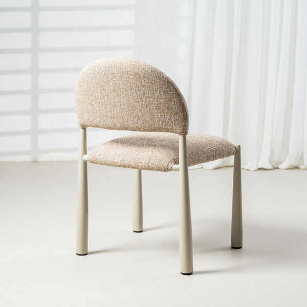 Beige upholstered dining chair with curved backrest and tapered wooden legs