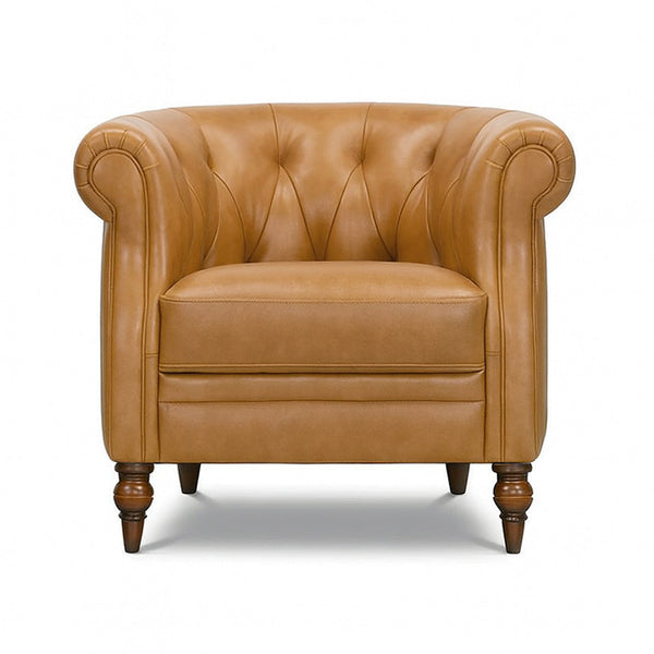 Tan Chesterfield accent chair with tufted back, rolled arms, and turned wood legs
