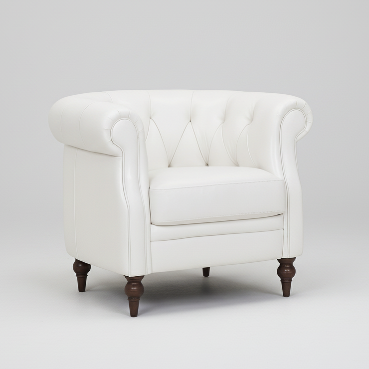 White Chesterfield accent chair with tufted back, rolled arms, and dark wood legs