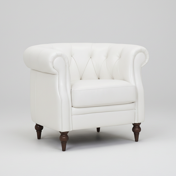 White Chesterfield accent chair with tufted back, rolled arms, and dark wood legs