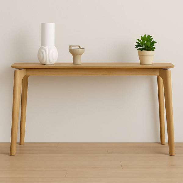 Light wood console table with tapered legs, open center, and smooth rectangular top