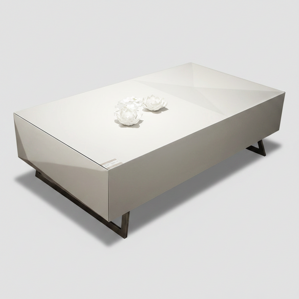 White rectangular coffee table with dark angled legs, side view, floral decor on top