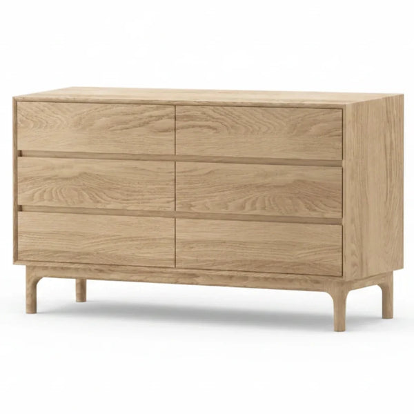 A light oak wood six-drawer dresser with a mid-century modern design, featuring tapered legs and a natural wood grain finish, shown on a plain white background.