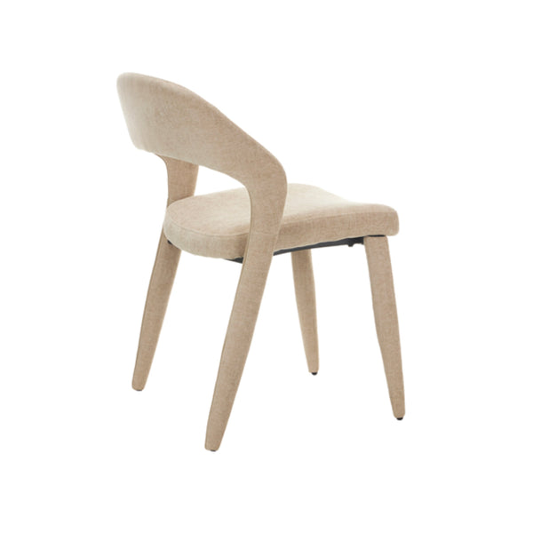 Side view beige fabric dining chair with arched back and tapered wooden legs