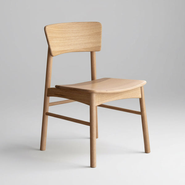 Light wood dining chair with curved backrest, wooden seat, and straight legs