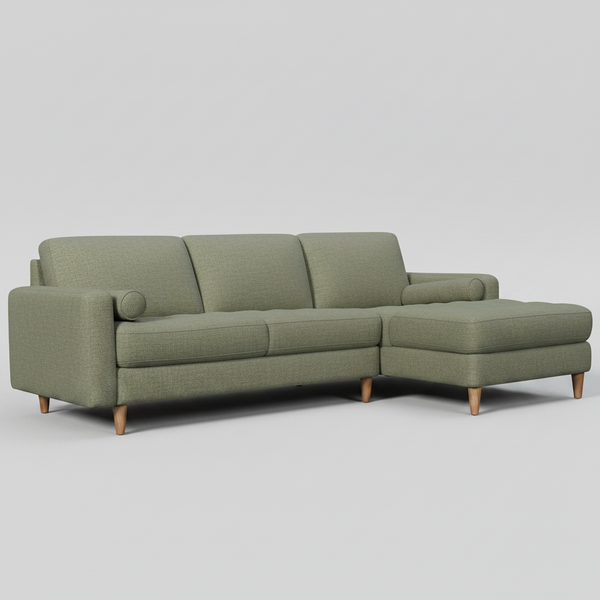 Green sectional sofa on a white background