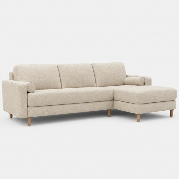 Beige fabric chaise sofa with rounded backrest and chaise extension, front 3/4 view