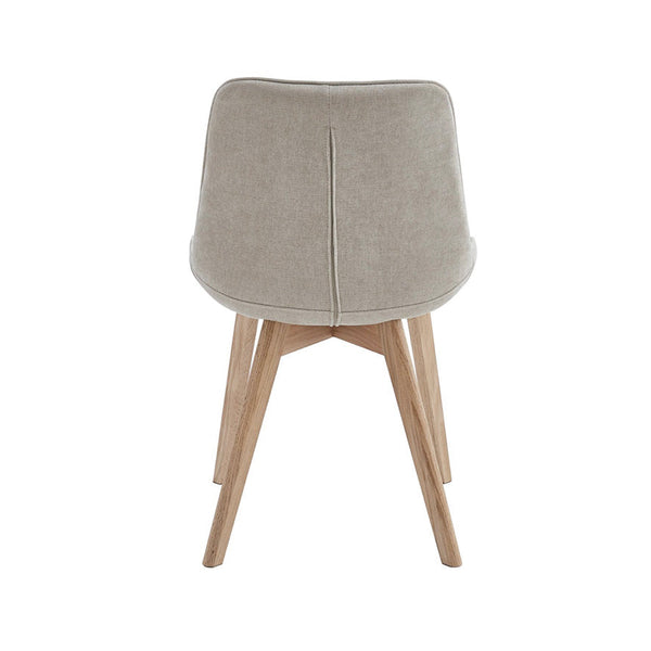 Taupe upholstered dining chair with solid back panel and natural wood tapered legs