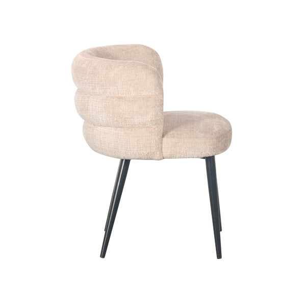 Light beige dining chair with curved back, padded seat, and black tapered legs