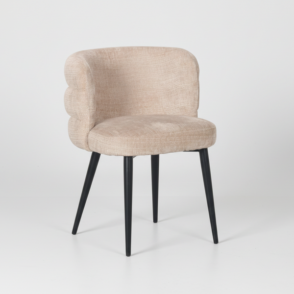 Light beige dining chair with padded seat and back, curved arms, and black tapered legs