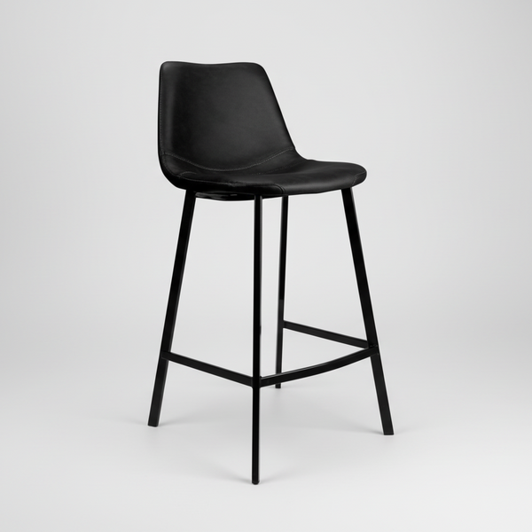 Black upholstered bar stool with contoured seat, open frame footrest, four metal legs.