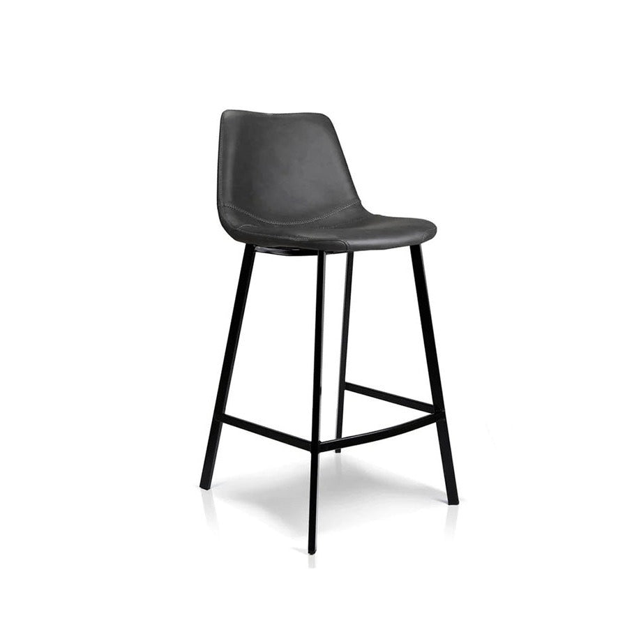 Antique black bar stool with curved padded back and seat, metal footrest