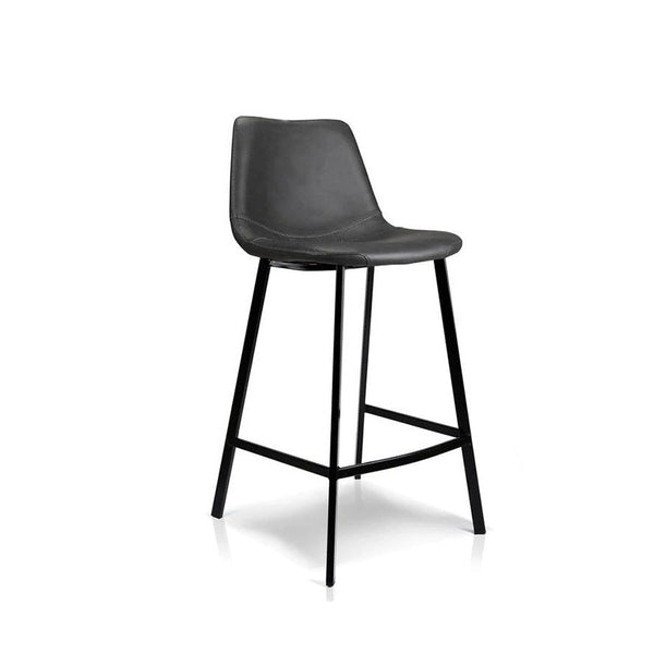 Antique black bar stool with curved padded back and seat, metal footrest
