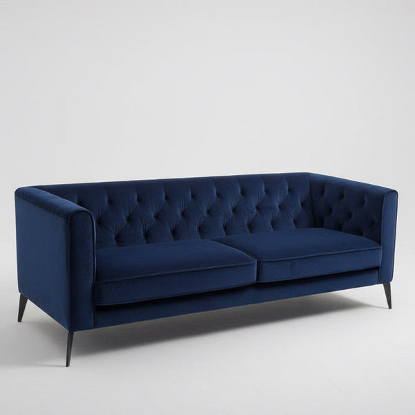 Chesterfield velvet sofa in deep navy blue, tufted back and rolled arms