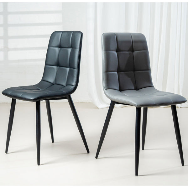 Black quilted dining chair with padded seat, tufted back, angled legs